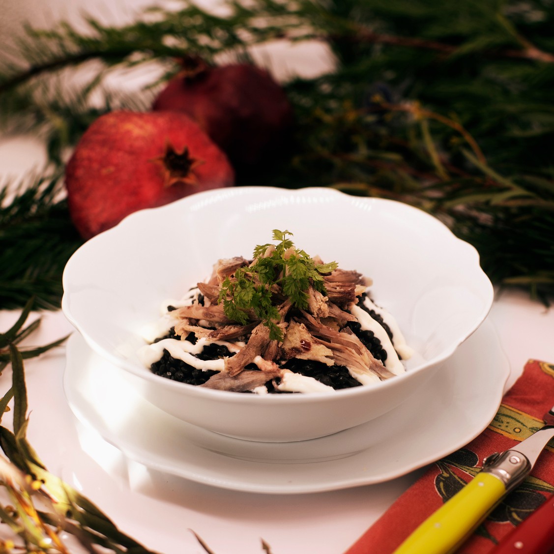 Rosemary-Infused Beluga Lentils with Duck Confit & Pomegranate Gastrique